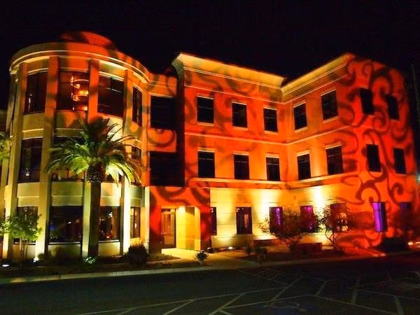 Building exterior lit with gobo lighting at night