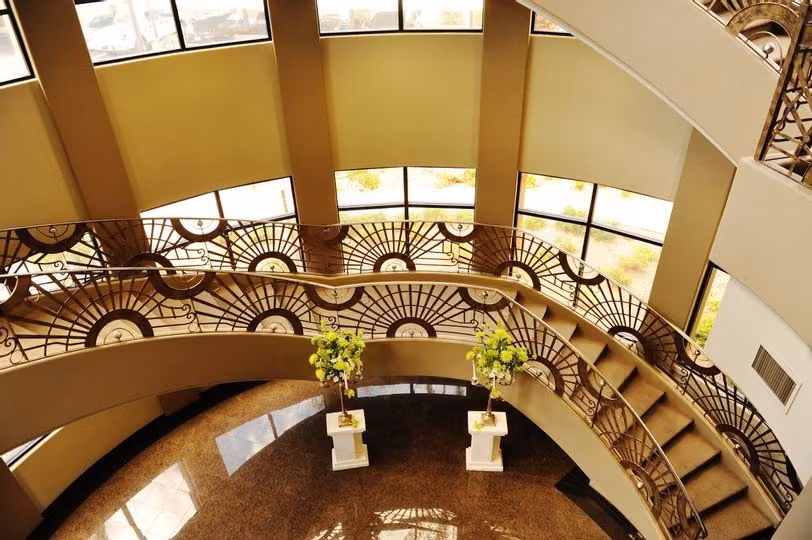 Looking down the ornate grand staircase to the foyer